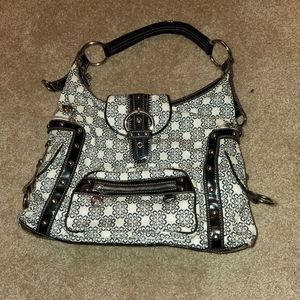 This is a pretty purse it is big and can hold about anything.